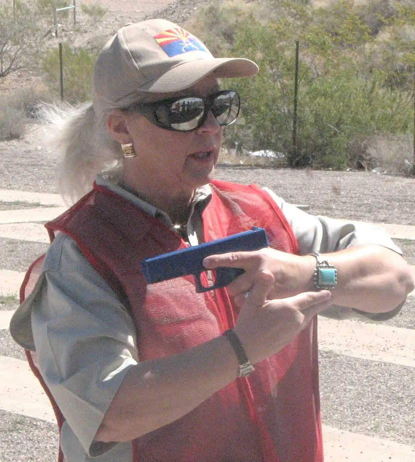 Women instructor with a pistol