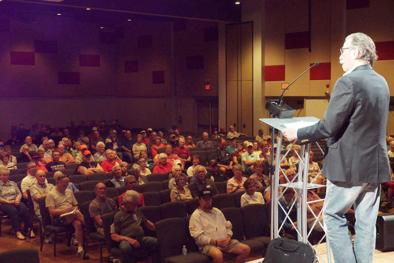 A large crowd of people in the auditorium.