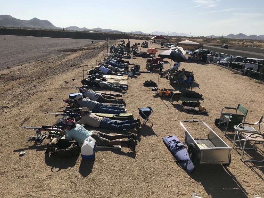 A group of people laying down on the ground.